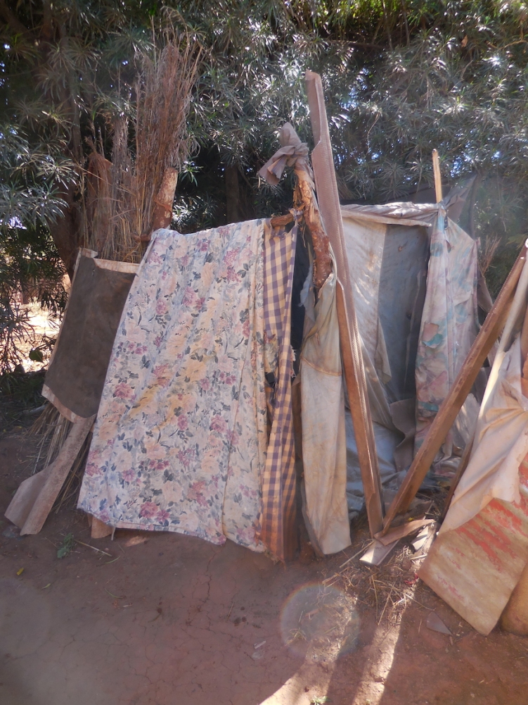 As Brenda and her family did not have a latrine of their own, they walked to this neighbour's latrine, 3 houses away.