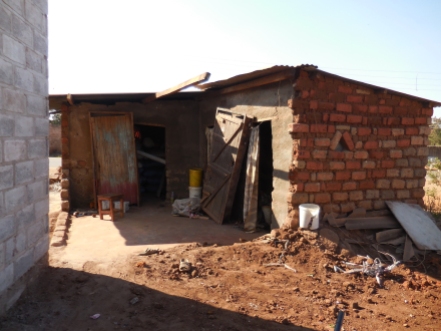 Brenda and her 2 children and 3 grandchildren (of her late daughter) live in this small house while we build her new home right beside it.